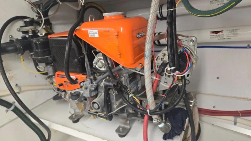 Slide: The Image of Engine compartment of a 2012 Custom Steel Trawler with visible wiring and components. - 62