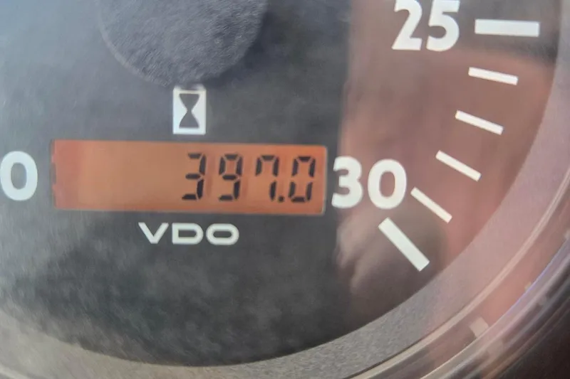 Slide: The Image of Close-up of a VDO gauge displaying 397.0 hours on a 2012 Custom Steel Trawler. - 63