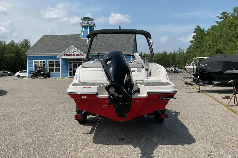 Slide: The Image of 2025 Bayliner VR5 OB boat at Port Harbor Marine, featuring a sleek red and white design. - 7