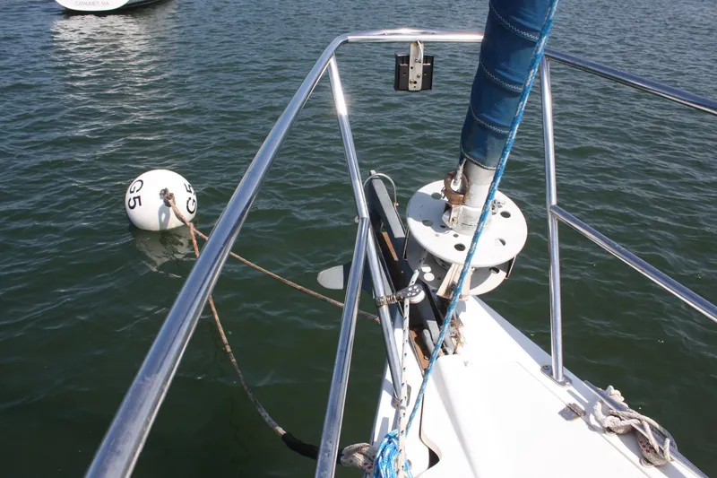 Slide: The Image of Bow of 1998 Catalina 42 MkII sailboat with mooring buoy in water. - 15
