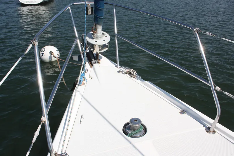 Slide: The Image of Bow of a 1998 Catalina 42 MkII sailboat with railing and mooring buoy. - 16