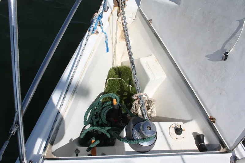 Slide: The Image of Anchor locker of a 1998 Catalina 42 MkII sailboat with ropes and chain. - 17