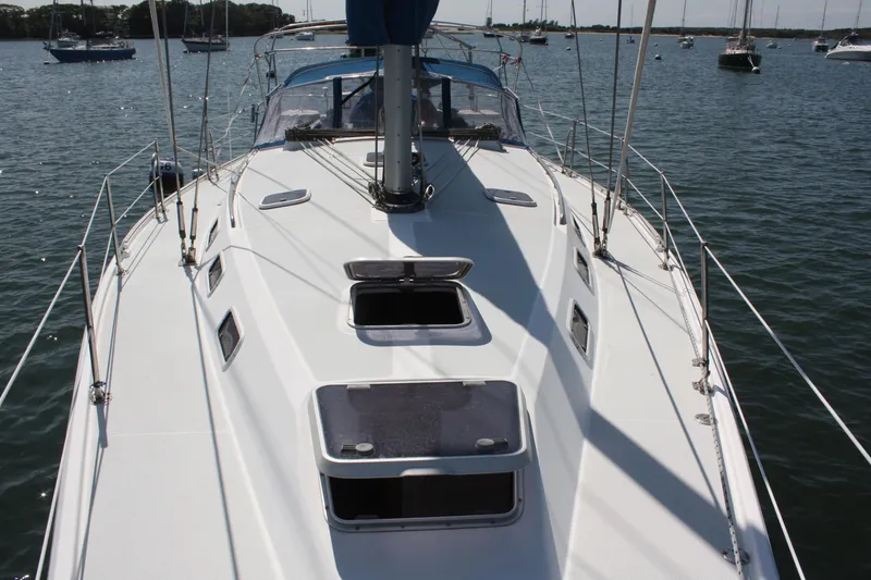 Slide: The Image of 1998 Catalina 42 MkII sailboat deck view on calm water. - 18