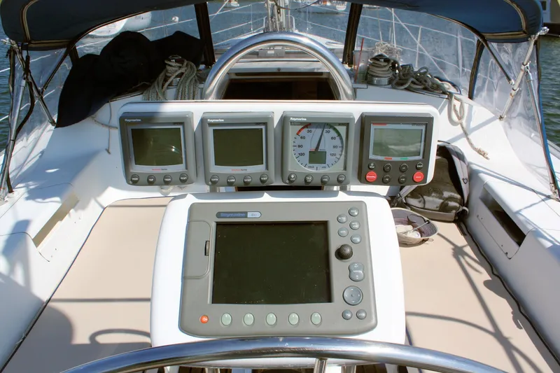 Slide: The Image of Cockpit of 1998 Catalina 42 MkII sailboat with navigation instruments and steering wheel. - 24