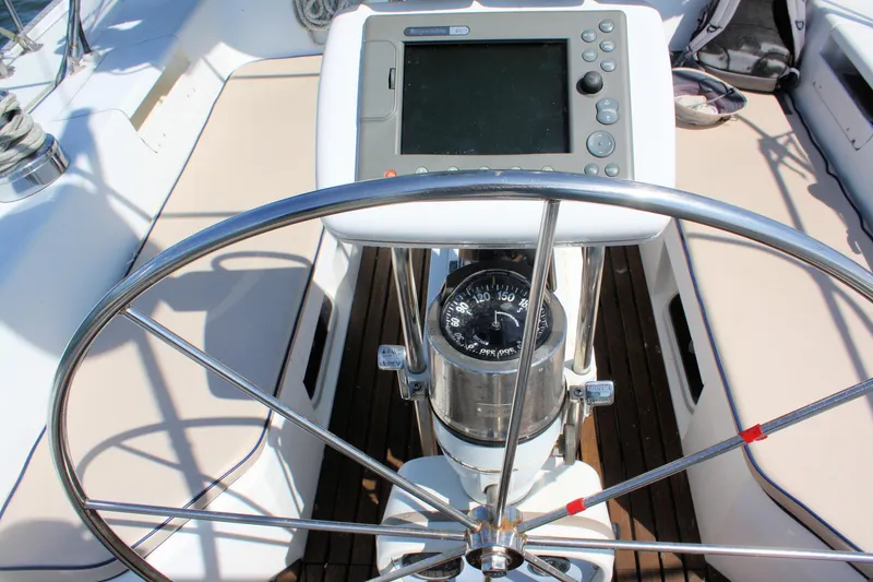 Slide: The Image of Steering wheel and navigation system on a 1998 Catalina 42 MkII sailboat. - 25