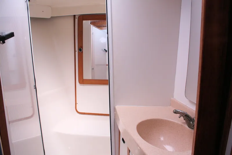 Slide: The Image of Bathroom interior of 1998 Catalina 42 MkII sailboat with sink and mirror. - 26