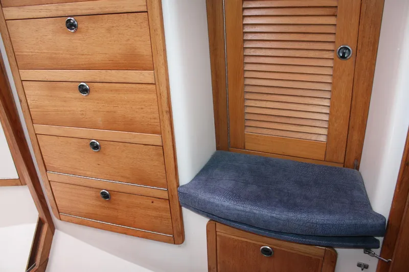 Slide: The Image of Wooden cabinetry and cushioned seat in 1998 Catalina 42 MkII yacht interior. - 32