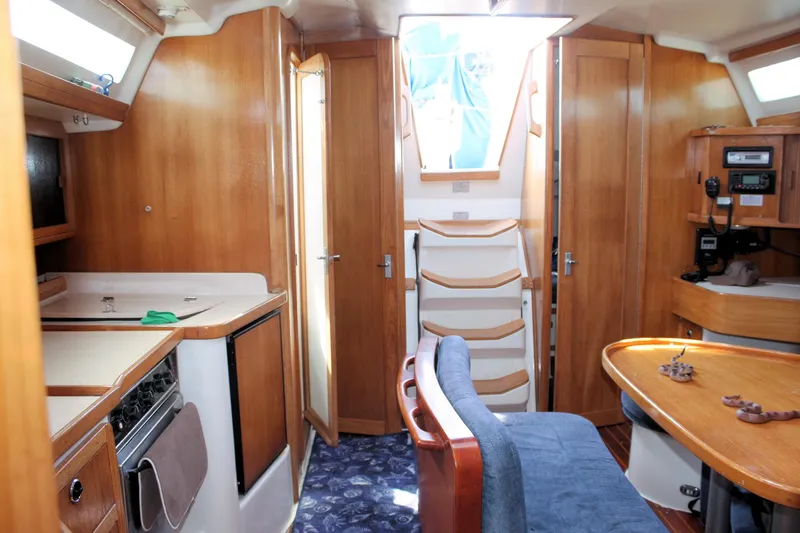 Slide: The Image of Interior of 1998 Catalina 42 MkII sailboat with wood finish and cozy seating area. - 34