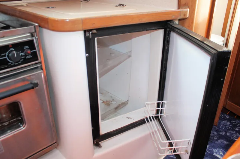 Slide: The Image of Open refrigerator in 1998 Catalina 42 MkII yacht kitchen, next to stainless steel oven. - 39