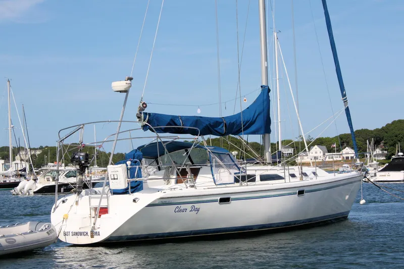 Slide: The Image of Sailboat Catalina 42 MkII 1998 anchored in a marina with blue sail cover. - 7