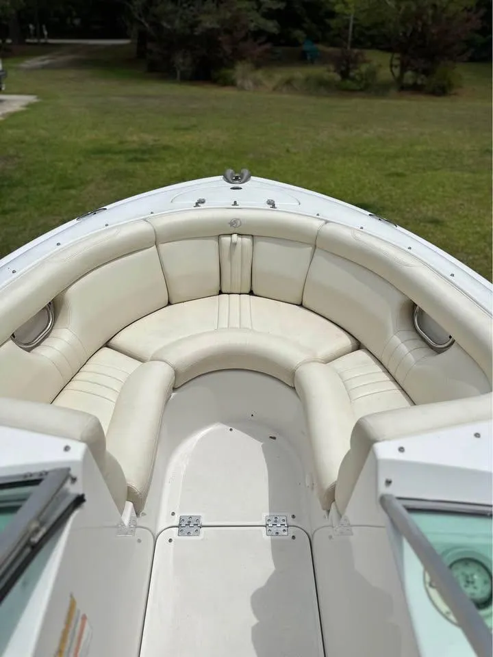 Slide: The Image of 2001 Chris-Craft Launch 22 boat interior with white leather seating. - 5