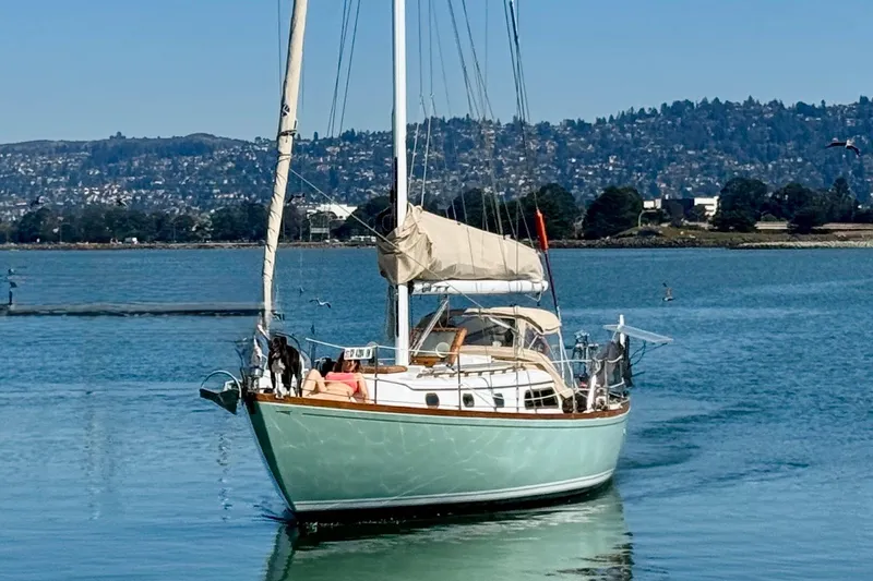 The Image of 1970 Cheoy Lee Luders 36 sailboat on calm water with scenic background. - 0