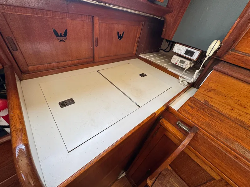 Slide: The Image of 1970 Cheoy Lee Luders 36 yacht interior with wooden cabinetry and navigation equipment. - 17