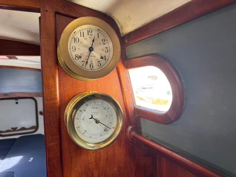 Slide: The Image of Interior of 1970 Cheoy Lee Luders 36 yacht with clock and barometer on wooden panel. - 30