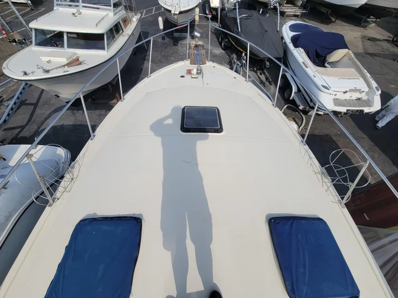 Slide: The Image of 1979 Bayliner 3250 boat dashboard with gauges, steering wheel, and navigation equipment. - 8