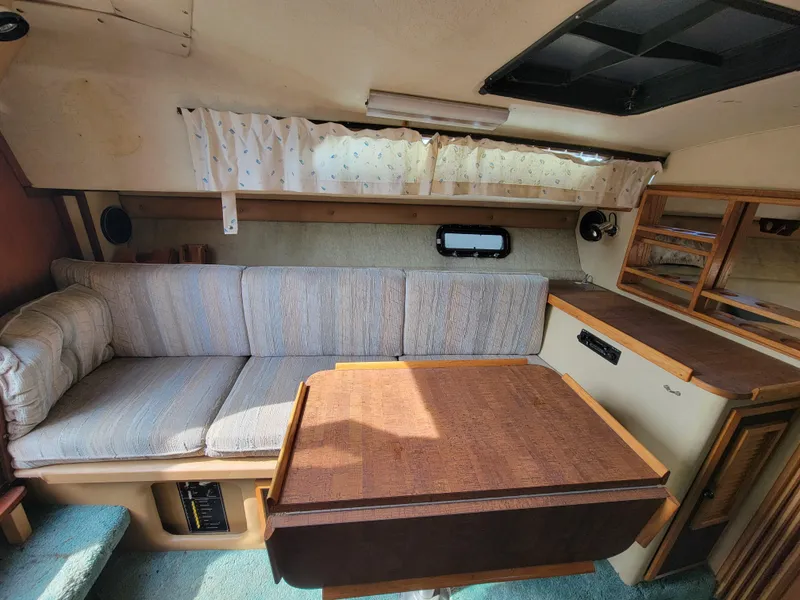 Slide: The Image of 1979 Bayliner 3250 boat dashboard with steering wheel and control panel. - 9