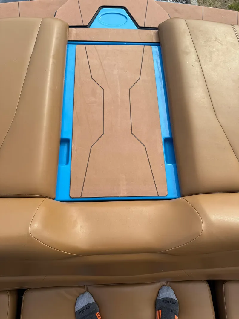 Slide: The Image of Brown and blue seating area on a 2022 Axis T250 boat. - 21
