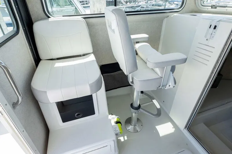 Slide: The Image of 2025 Parker 2820 XLD Sport Cabin interior with white seating and modern design. - 10