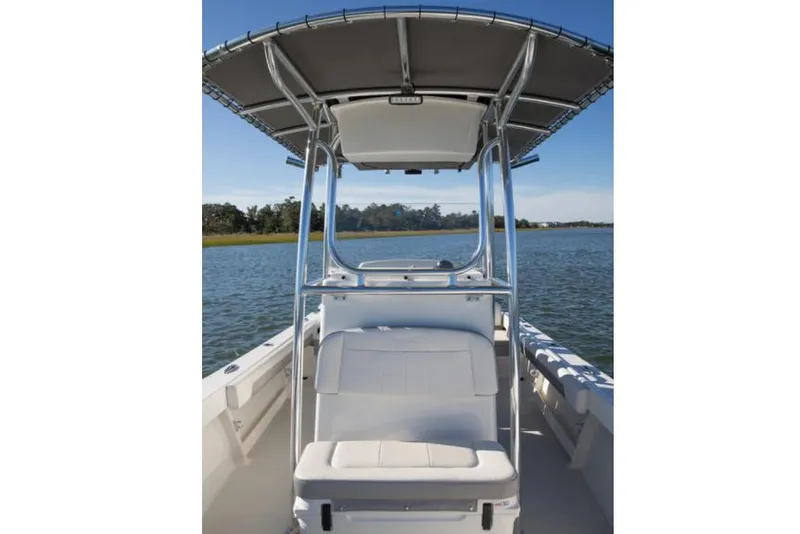 Slide: The Image of 2025 Parker 21SE Center Console boat on calm water, featuring a sleek design and spacious seating. - 4