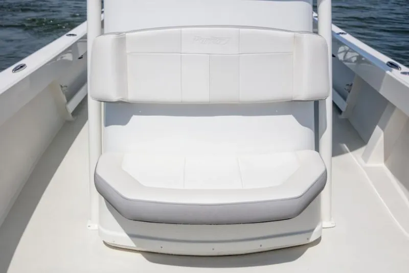 Slide: The Image of Manufacturer Provided Image: 2025 Parker 23SE Center Console boat with white cushioned seating. - 3