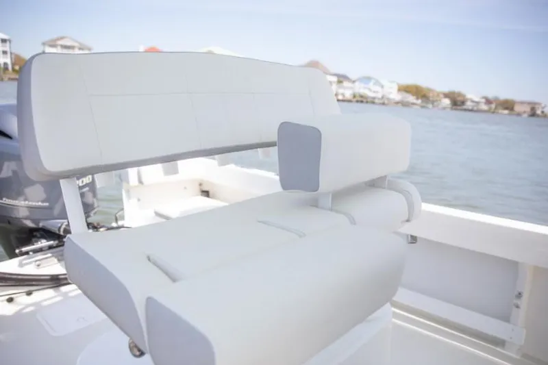 Slide: The Image of Manufacturer Provided Image: 2025 Parker 23SE Center Console boat seat with waterfront view. - 5