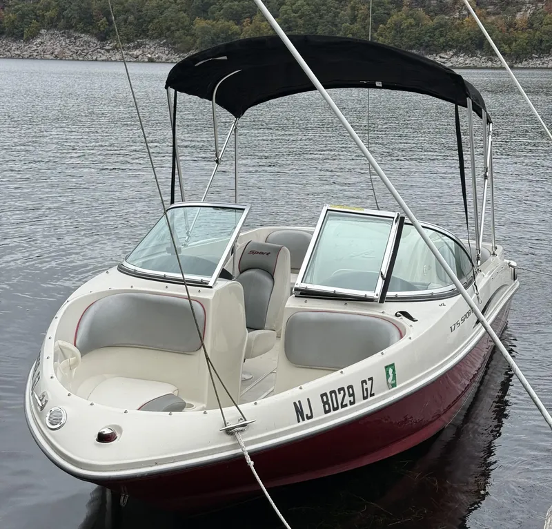 Slide: The Image of 2008 Sea Ray 175 Sport boat with canopy on a calm lake. - 13