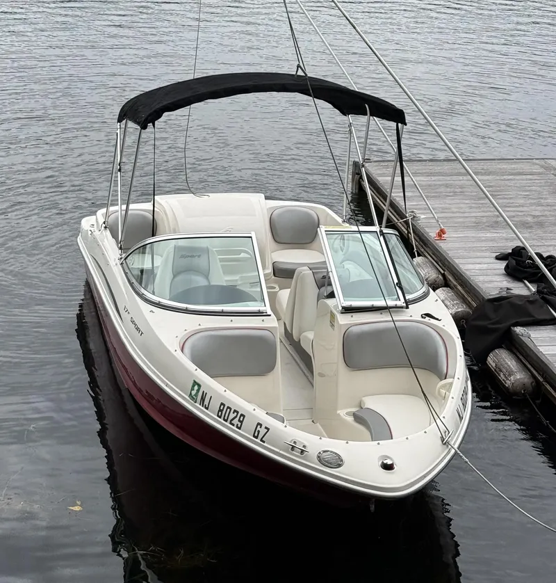 Slide: The Image of 2008 Sea Ray 175 Sport boat docked on calm water. - 16