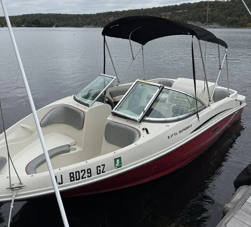 Slide: The Image of 2008 Sea Ray 175 Sport boat docked on a calm lake. - 9