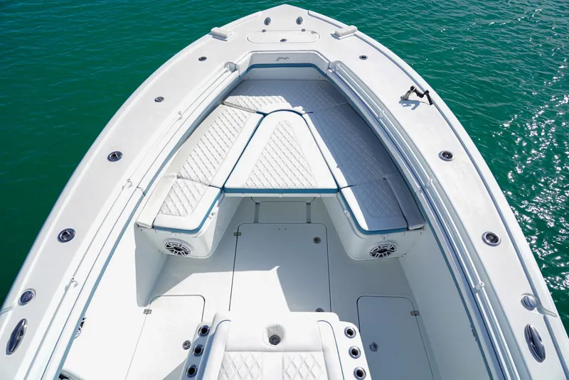 Slide: The Image of 2023 Yellowfin 42 boat with spacious seating on calm water. - 6