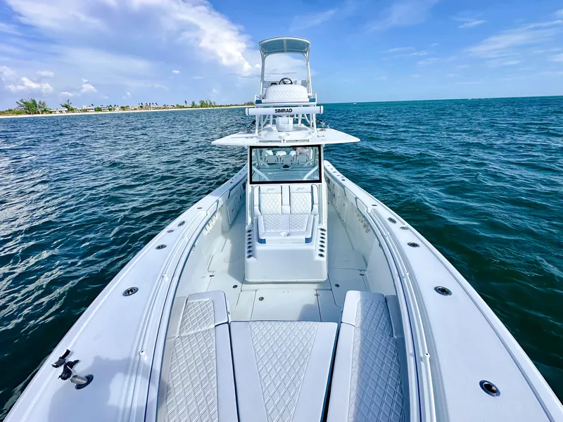 Slide: The Image of 2023 Yellowfin 42 boat on open water, showcasing sleek design and spacious deck. - 7