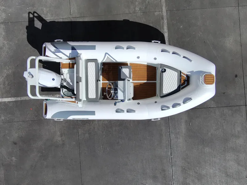Slide: The Image of Overhead view of 2025 Tide Craft Nantucket 12 boat on concrete surface. - 6