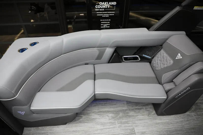 Slide: The Image of Luxurious gray seating in 2025 Viaggio Diamante UWA boat, featuring cup holders and elegant design. - 14