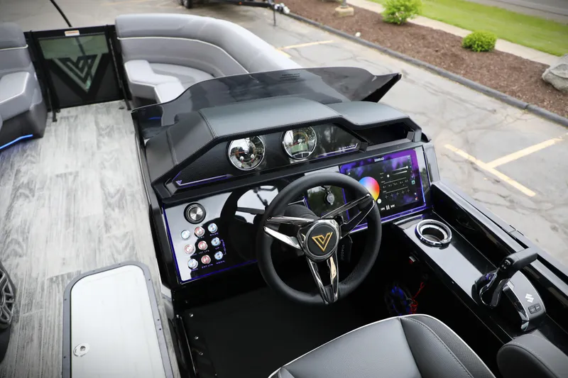 Slide: The Image of 2025 Viaggio Diamante UWA boat interior with modern dashboard and steering wheel. - 19