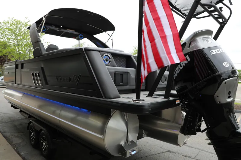Slide: The Image of 2025 Viaggio Diamante UWA pontoon boat with Suzuki 350 engine and American flag. - 23