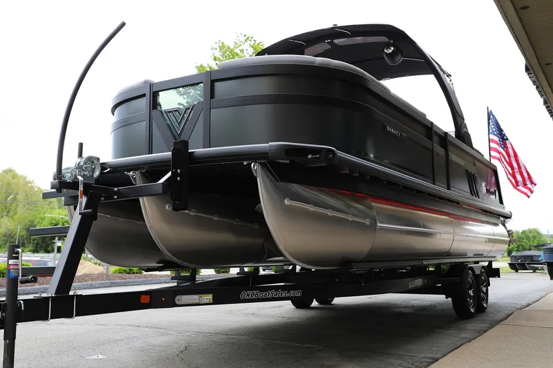 Slide: The Image of 2025 Viaggio Diamante UWA pontoon boat on trailer with American flag. - 4