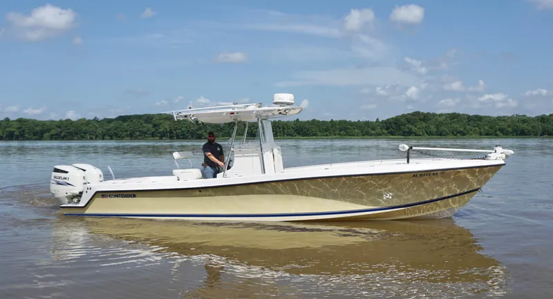 Slide: The Image of 2003 Contender 31 Open boat on calm water under blue sky. - 1