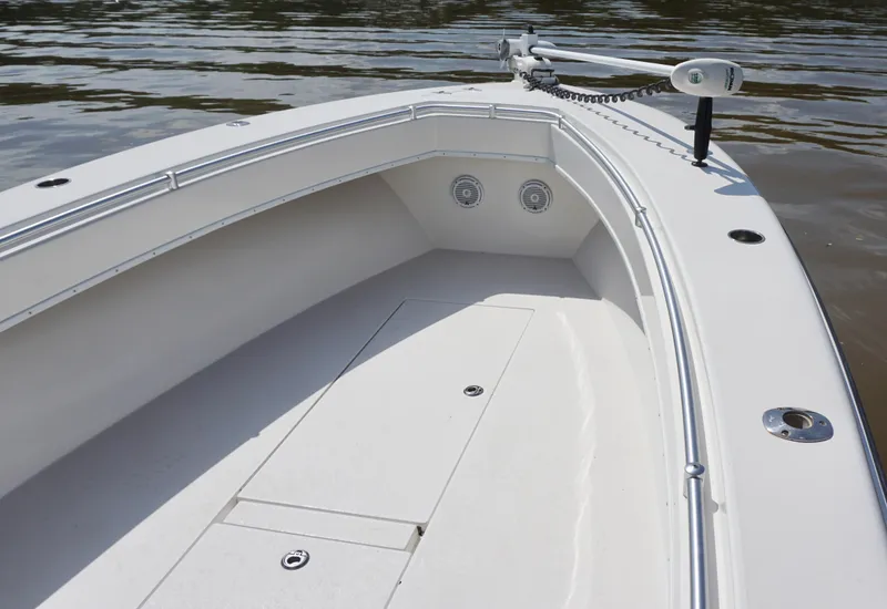 Slide: The Image of 2003 Contender 31 Open boat deck with trolling motor on calm water. - 18