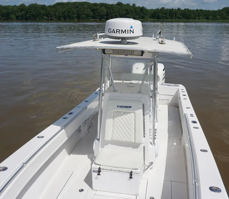 Slide: The Image of 2003 Contender 31 Open boat with Garmin radar on calm water. - 21