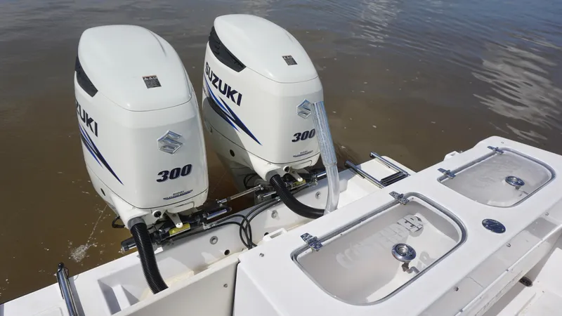 Slide: The Image of Twin Suzuki 300 outboard engines on a 2003 Contender 31 Open boat. - 9