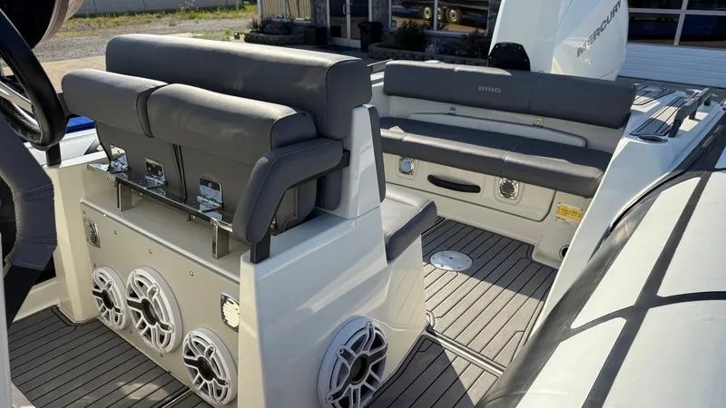 Slide: The Image of 2022 Brig Eagle 8 boat interior with gray seating and modern design. - 12