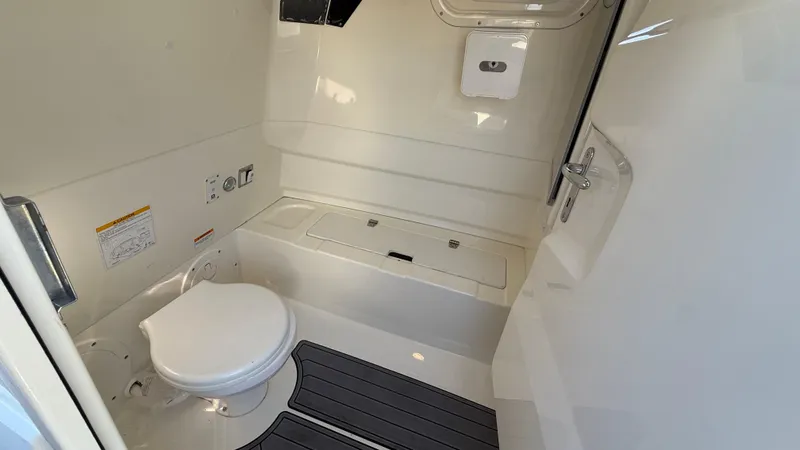 Slide: The Image of 2022 Brig Eagle 8 boat interior with compact marine toilet and storage. - 15