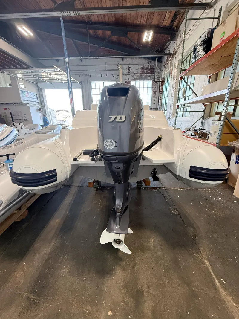 Slide: The Image of 2024 AB Inflatables Nautilus 15 DLX with 70 HP engine in a warehouse setting. - 17
