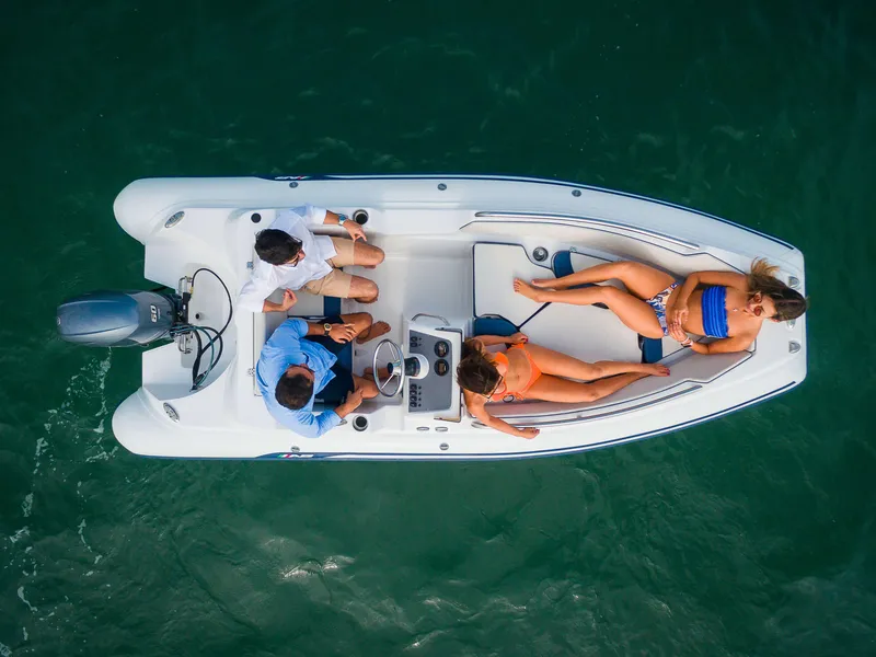 Slide: The Image of 2024 AB Inflatables Nautilus 15 DLX boat with passengers on open water. - 19