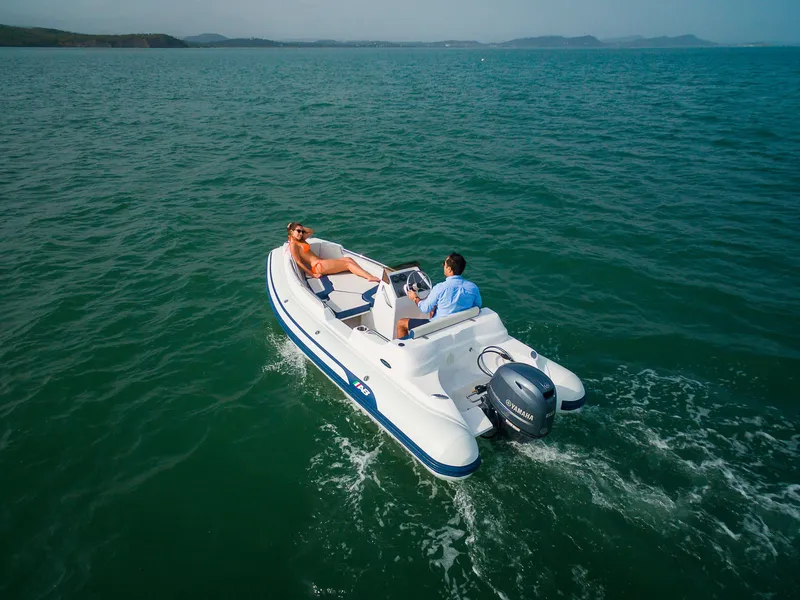Slide: The Image of 2024 AB Inflatables Nautilus 15 DLX cruising on open water. - 20