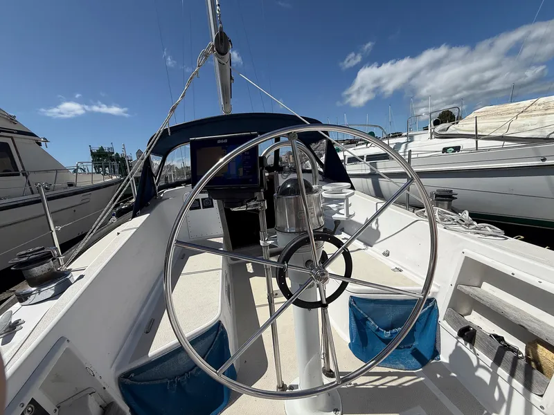 Slide: The Image of Cockpit of 1982 Tartan 37 sailboat with steering wheel and navigation equipment. - 10