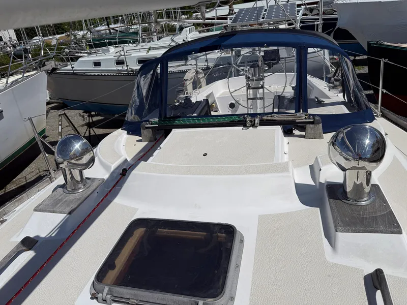 Slide: The Image of 1982 Tartan 37 sailboat deck with chrome fittings and cockpit view. - 13