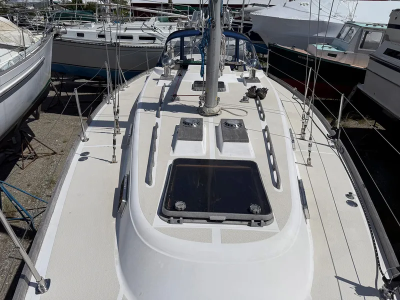 Slide: The Image of 1982 Tartan 37 sailboat deck view, showcasing rigging and hatches. - 18