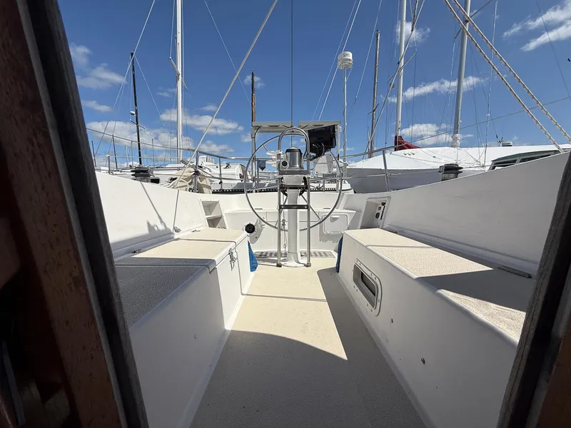 Slide: The Image of Cockpit view of a 1982 Tartan 37 sailboat with clear blue skies. - 30
