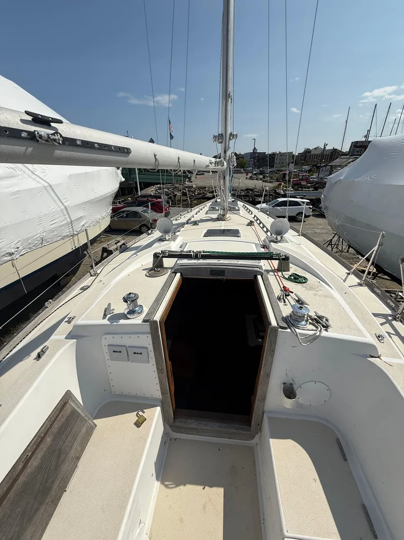 Slide: The Image of 1982 Tartan 37 sailboat deck view in a marina setting. - 7