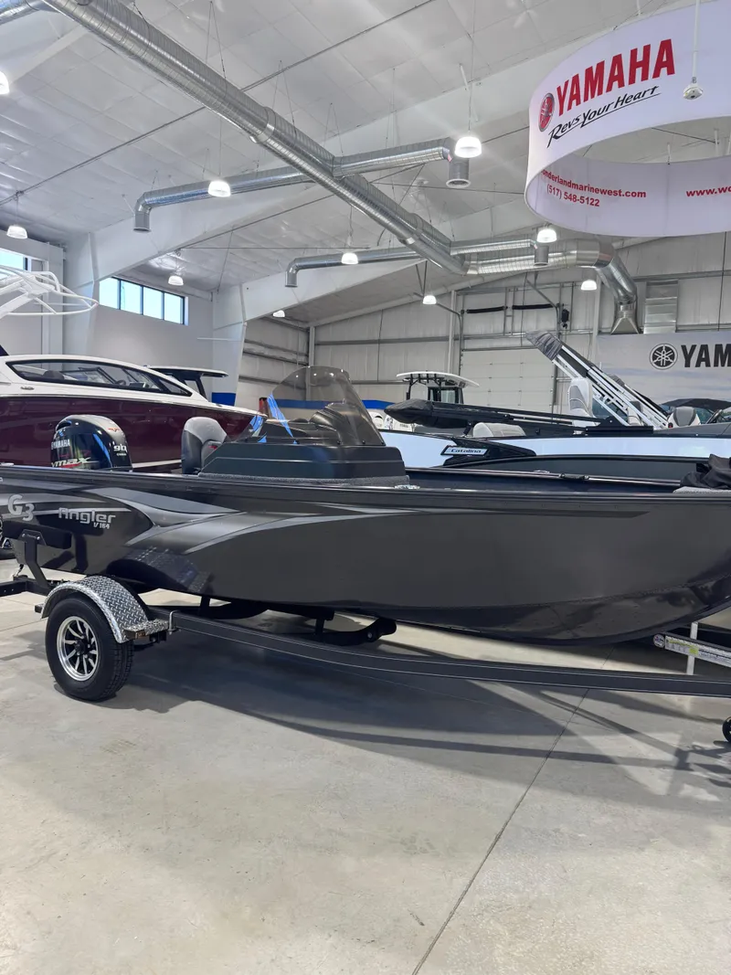The Image of 2025 G3 AV-164C Carpet boat displayed in showroom with Yamaha signage. - 1